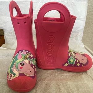 Kids Crocs rain boots.